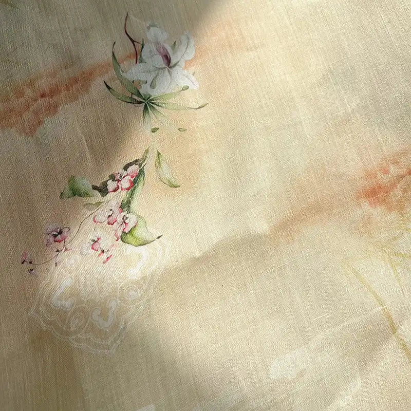 Retro Botanical Printed Ramie Fabric by Longan Craft features a soft beige background adorned with a chinoiserie-inspired floral watercolor design of white and pink flowers accented by green leaves, gently illuminated as if by sunlight—ideal for blouses and sold by the yard.