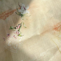 Retro Botanical Printed Ramie Fabric by Longan Craft features a soft beige background adorned with a chinoiserie-inspired floral watercolor design of white and pink flowers accented by green leaves, gently illuminated as if by sunlight—ideal for blouses and sold by the yard.