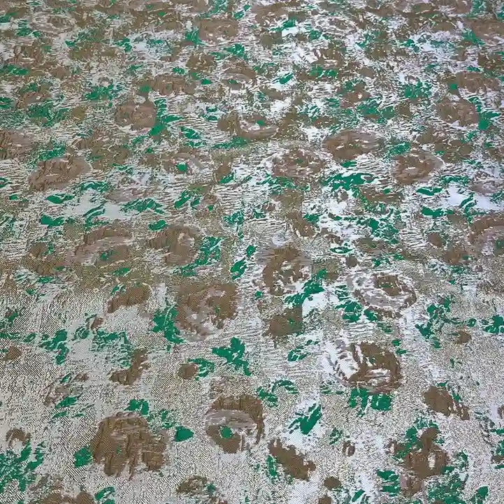 The Rose Jacquard Brocade by Longan Craft features a textured surface with green, brown, and silver metallic patches in an abstract floral pattern, evoking retro brocade for elegant formal dresses.