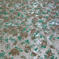 The Rose Jacquard Brocade by Longan Craft features a textured surface with green, brown, and silver metallic patches in an abstract floral pattern, evoking retro brocade for elegant formal dresses.