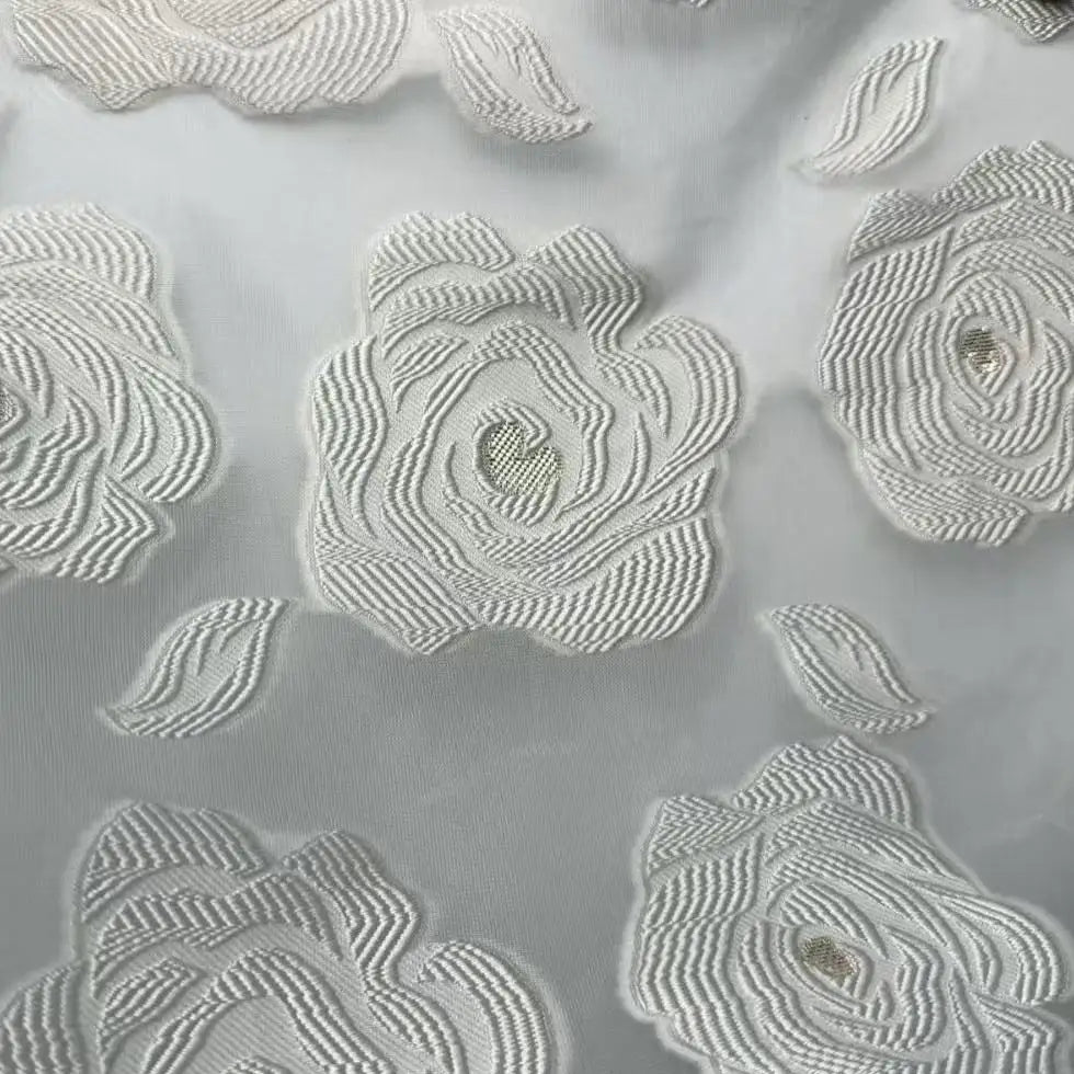 Close-up of Longan Craft's Rose Jacquard Organza Fabric By The Yard, a vintage multicolor organza material with embroidered floral and rose designs—perfect for skirts and featuring semi-transparent detailing.