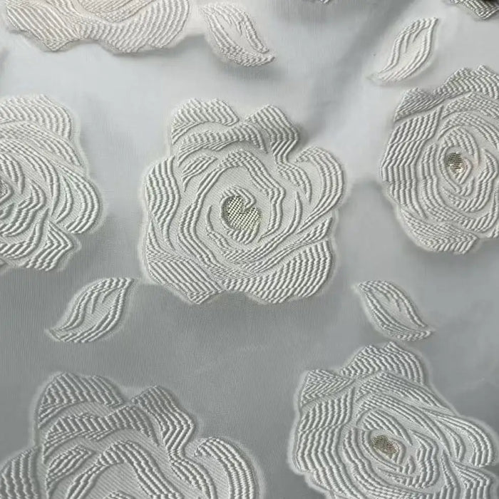 Close-up of Longan Craft's Rose Jacquard Organza Fabric By The Yard, a vintage multicolor organza material with embroidered floral and rose designs—perfect for skirts and featuring semi-transparent detailing.
