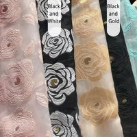 Five sheer Longan Craft Rose Jacquard Organza Fabrics feature large embroidered roses in light pink, black and white, black and gold, beige, and light blue. Black and White and Black and Gold are two available options.
