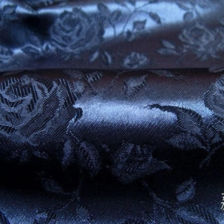 Close-up of Longan Craft's Rose Jacquard Satin Fabric by the Yard, a colorful polyester material with detailed embossed floral designs—perfect for costumes and crafts.