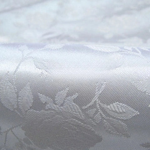 Close-up of Rose Jacquard Satin Fabric by Longan Craft—a colorful polyester floral jacquard satin textile with a luxurious texture and sheen, ideal for costumes and creative projects. Sold by the yard.