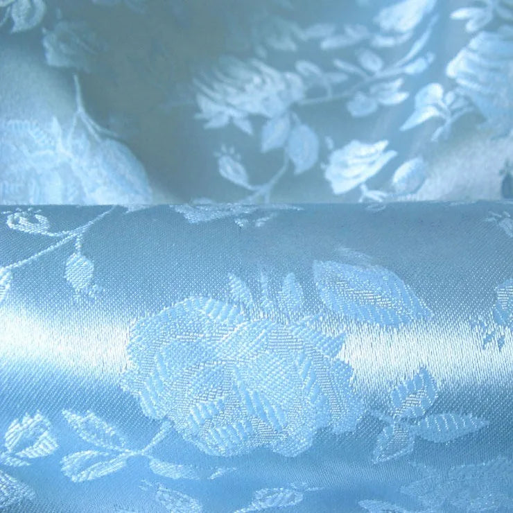 Longan Craft’s Rose Jacquard Satin Fabric By The Yard features a colorful polyester floral pattern with roses and leaves, offering an elegant satin textile with a soft sheen—perfect for costumes and crafts.