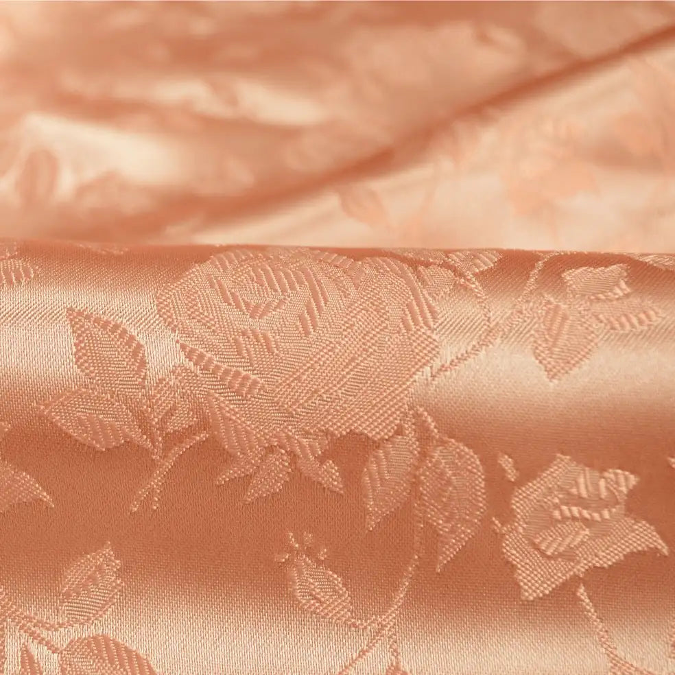 Close-up of Rose Jacquard Satin Fabric by the yard from Longan Craft, a colorful polyester satin material with embossed roses and leaves, featuring a smooth, shiny texture and intricate floral detailing—ideal for costumes.