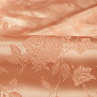 Close-up of Rose Jacquard Satin Fabric by the yard from Longan Craft, a colorful polyester satin material with embossed roses and leaves, featuring a smooth, shiny texture and intricate floral detailing—ideal for costumes.