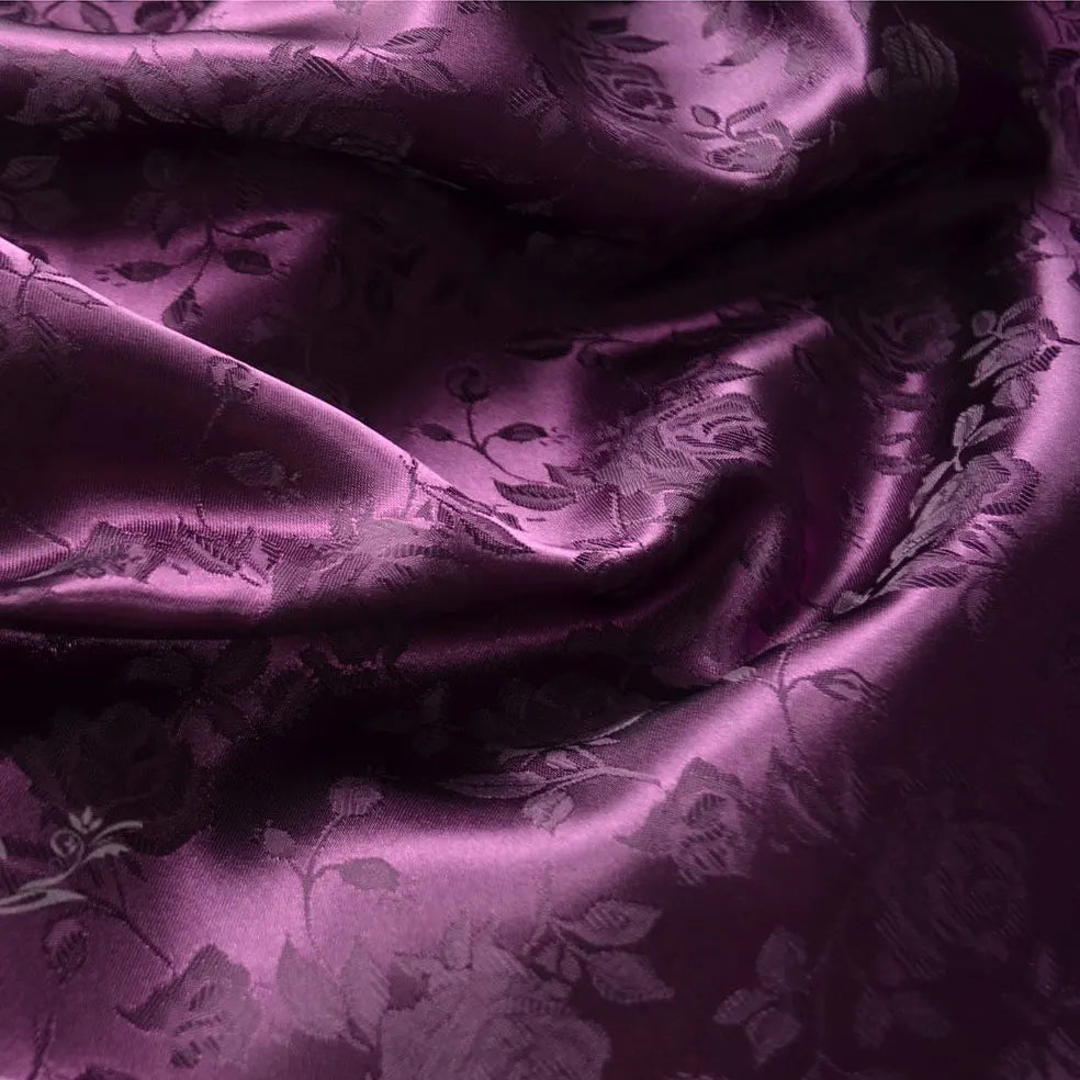 Close-up of Longan Craft's Rose Jacquard Satin Fabric By The Yard, a colorful polyester floral jacquard satin material with soft folds and a lustrous finish—ideal textile for costumes.