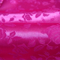Close-up of Rose Jacquard Satin Fabric by Longan Craft, a colorful polyester floral jacquard satin with an embossed leaf and flower pattern, perfect for costumes and sold by the yard.