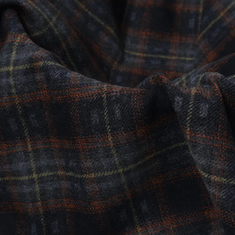 Semi Worsted Plaid Wool Fabric By The Yard in dark charcoal with a plaid pattern of rust orange and yellow lines.