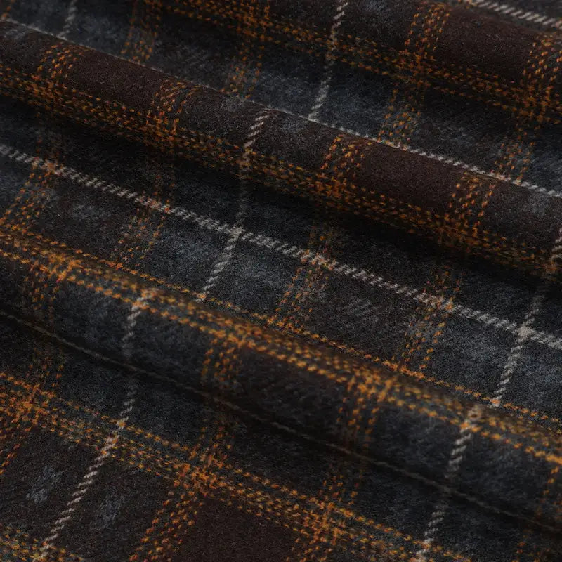 Semi Worsted Plaid Wool Fabric By The Yard in dark grey with an orange and white plaid pattern, ideal for coats.
