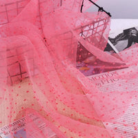 Sheer Swiss Dot Organza Fabric By The Yard in pink, featuring raised, colorful 3D dots.