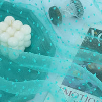 Sheer teal Longan Craft Swiss Dot Organza Fabric with raised, fuzzy 3D dots.