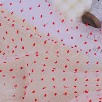 Sheer beige Sheer Swiss Dot Organza Fabric By The Yard featuring small, raised red dots.