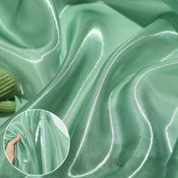 Longan Craft’s Shiny Liquid Organza Fabric By The Yard features a colorful glossy finish and luxurious texture, ideal for organza gowns. Inset displays a hand holding and stretching the fabric to show off its sheen and quality.