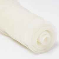 A close-up of Longan Craft's Silky Polyester Organza Fabric By The Yard, a premium solid color, soft and sheer bridal organza material, rolled and displayed on a white background.