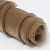 Longan Craft's Silky Polyester Organza Fabric By The Yard is a premium, soft, sheer bridal material in light brown—ideal for elegant gowns or evening dresses. The delicate fabric is shown coiled on a white surface.