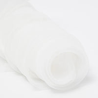 A close-up of Longan Craft's Silky Polyester Organza Fabric By The Yard in premium solid color, soft and sheer—ideal for bridal gowns or evening dresses—features the lightweight material rolled up on a white background.