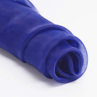 A close-up of Longan Craft’s Silky Polyester Organza Fabric By The Yard in sheer royal blue, loosely coiled—this premium solid color organza is soft, perfect for bridal or evening wear.