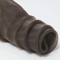 A close-up of Longan Craft's Silky Polyester Organza Fabric By The Yard shows dark brown, sheer, lightweight premium organza—soft with a slight sheen—ideal for bridal gowns and evening dresses, rolled up on a white surface.