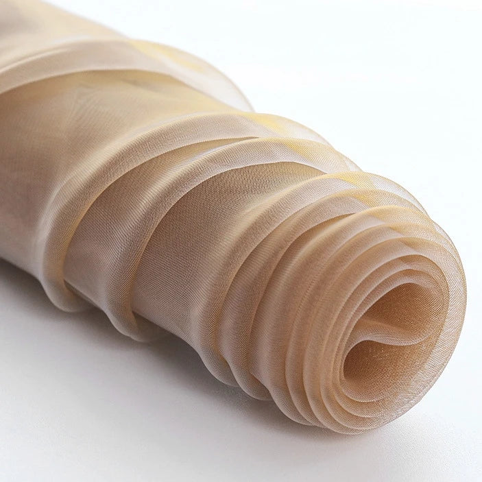 A close-up of Longan Craft’s Silky Polyester Organza Fabric by the Yard, a premium solid color organza material that’s soft, sheer, and perfect for bridal gowns or evening dresses—showcasing its delicate, translucent layers.