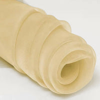 A close-up of Longan Craft's Silky Polyester Organza Fabric By The Yard, a premium soft and sheer bridal organza material in beige, perfect for evening dresses or gowns, shown rolled up on a light surface.