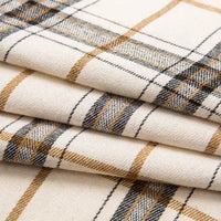 Here’s a rewritten sentence using your product data: Close-up of folded Single Sided Sueded Plaid Flannel Fabric By The Yard from Longan Craft, featuring a cream base with black and light brown plaid lines. This medium weight, premium soft polyester cotton flannel displays a classic pattern and smooth texture—ideal for flannel clothing or craft projects.