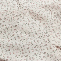 A close-up of Longan Craft’s Small Floral Printed Voile Fabric by the yard shows its soft 100% cotton voile material with a charming botanical pattern—ideal for summer clothing and perfect for delicate, floral-inspired projects.