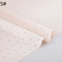 Small Polka Dot Jacquard Satin Fabric By The Yard from Longan Craft, shown in light pink with evenly spaced dots and zigzag cut edges, is displayed flat on a white surface. Number 5# appears in the top left corner.