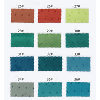 A grid of 12 Longan Craft Small Polka Dot Jacquard Satin swatches (#25–36) in assorted colors, each with zigzag edges and a dotted jacquard pattern, shown in three rows of four for this cozy satin clothing fabric.