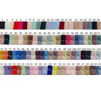 A collection of 151 fabric swatches, including Longan Craft’s Small Polka Dot Tulle Fabric by the yard—colorful, soft polyester tulle for dresses—each arranged in rows and labeled with a unique identification number.
