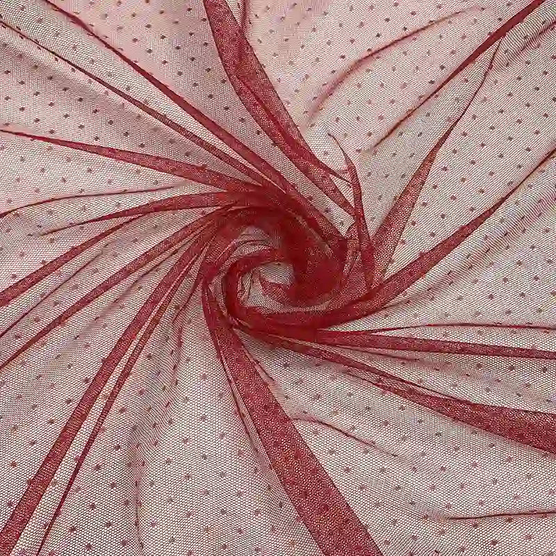 Longan Craft's Small Polka Dot Tulle Fabric by the yard is a colorful, soft polyester tulle with delicate polka dots—ideal for veils or giving wedding dresses a light, textured touch.