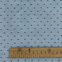 A close-up of Longan Craft’s Small Polka Dot Tulle Fabric By The Yard shows a light blue soft polyester tulle with a delicate dot pattern and a wooden ruler (4–13cm), ideal for dresses and veils.