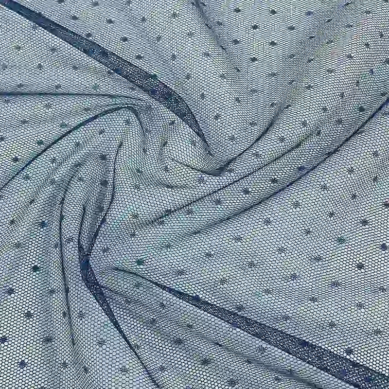 Close-up of Small Polka Dot Tulle Fabric by Longan Craft, a light blue, soft polyester tulle with small, evenly spaced polka dots—ideal for dresses, veils, or wedding projects. Available by the yard.