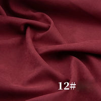 A close-up of Longan Craft’s Solid Color Brushed Polyester Peachskin Fabric shows its rich burgundy shade and velvety texture, perfect for dressmaking. The number 12# appears in white at the lower right corner.