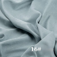 Longan Craft’s Solid Color Brushed Polyester Peachskin Fabric by the yard, shown in light blue with “16#” in white at the bottom right, features a soft, smooth, midweight microsuede texture—great for dressmaking.