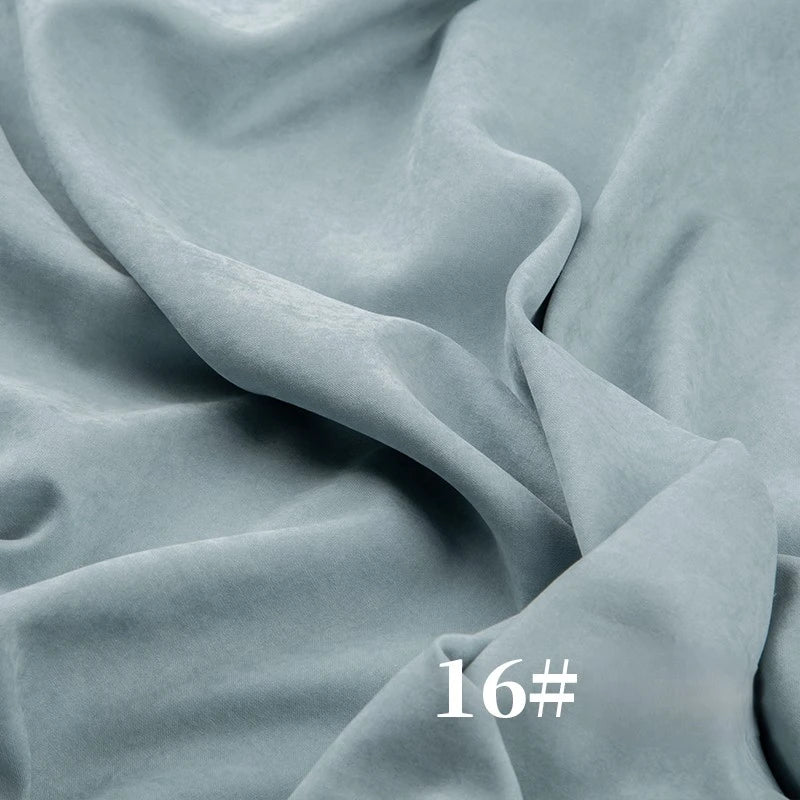 Longan Craft’s Solid Color Brushed Polyester Peachskin Fabric by the yard, shown in light blue with “16#” in white at the bottom right, features a soft, smooth, midweight microsuede texture—great for dressmaking.