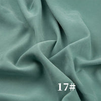 Longan Craft’s Solid Color Brushed Polyester Peachskin Fabric features a soft, velvety microsuede texture in light green—perfect for dressmaking. The number 17# is shown in white at the bottom right corner.