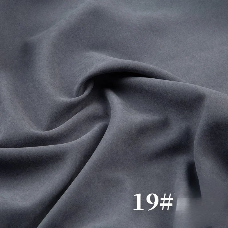 Longan Craft Solid Color Brushed Polyester Peachskin Fabric by the yard in dark gray, midweight microsuede with a velvety texture and gentle folds—ideal for dresses. "19#" appears in white at the bottom right.