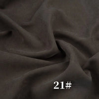 Longan Craft’s Solid Color Brushed Polyester Peachskin Fabric by the yard features soft, velvety midweight microsuede—ideal for dresses. The photo shows dark brown fabric with gentle folds and “21#” in white text at the bottom.