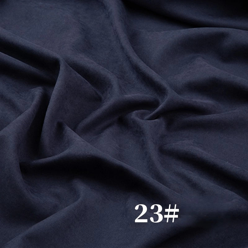 Longan Craft’s Solid Color Brushed Polyester Peachskin Fabric by the Yard in dark navy offers a soft, velvety texture and midweight feel—perfect for dressmaking. "23#" appears in white at the lower right of the fabric.