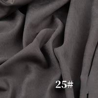 A close-up of Longan Craft’s Solid Color Brushed Polyester Peachskin Fabric by the Yard, a midweight microsuede with a soft, velvety texture in gray. The number 25# is printed in white at the bottom right corner.