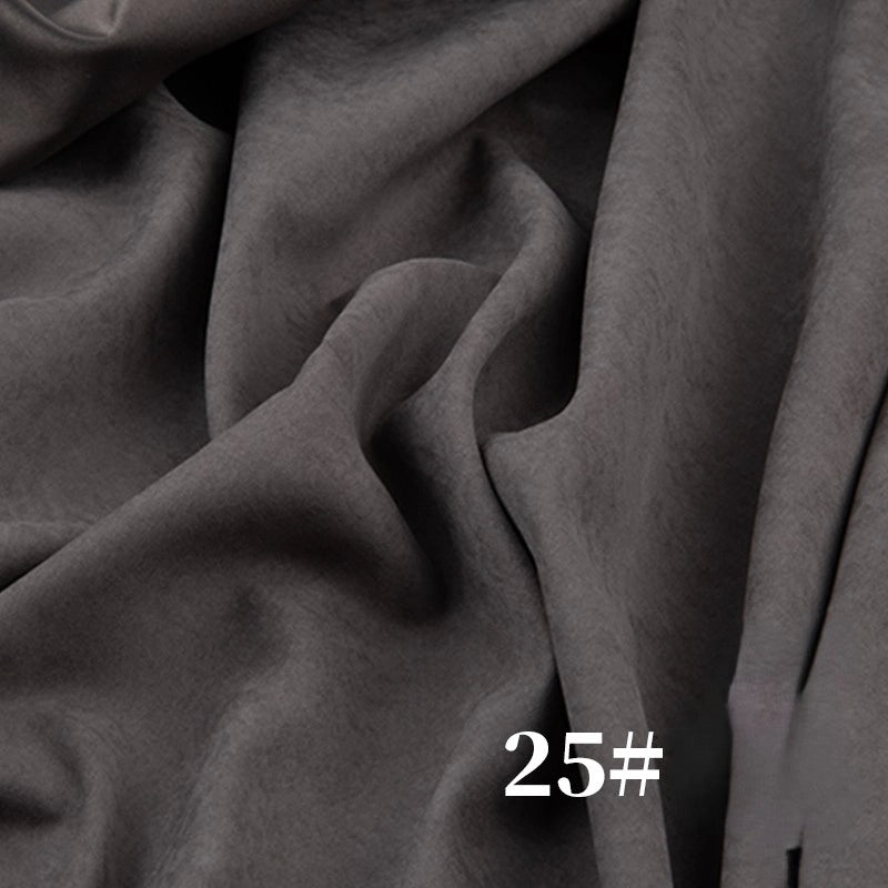 A close-up of Longan Craft’s Solid Color Brushed Polyester Peachskin Fabric by the Yard, a midweight microsuede with a soft, velvety texture in gray. The number 25# is printed in white at the bottom right corner.