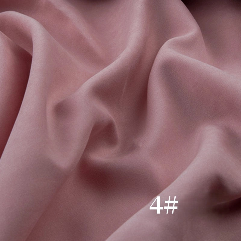 A close-up of Longan Craft’s Solid Color Brushed Polyester Peachskin Fabric By The Yard shows its soft, velvety texture with gentle folds. “4#” is printed in white text in the lower right corner.