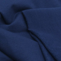 A close-up of Longan Craft's Solid Color Cotton French Terry Fabric by the yard, showcasing its dark blue thick material, soft texture, visible folds, and unfinished edge—perfect for hoodies.