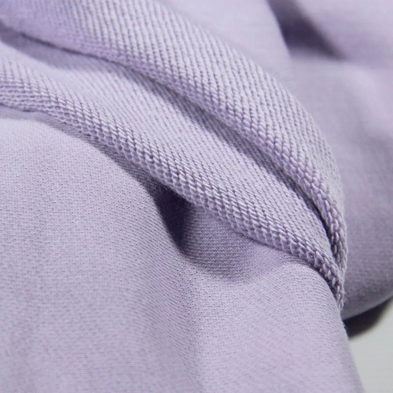 Close-up of Longan Craft Solid Color Cotton French Terry Fabric by the yard, showing its thick, soft texture and visible stitching—ideal material for hoodies.