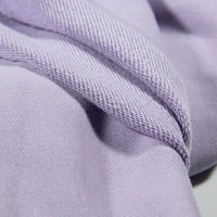 Close-up of Longan Craft Solid Color Cotton French Terry Fabric by the yard, showing its thick, soft texture and visible stitching—ideal material for hoodies.