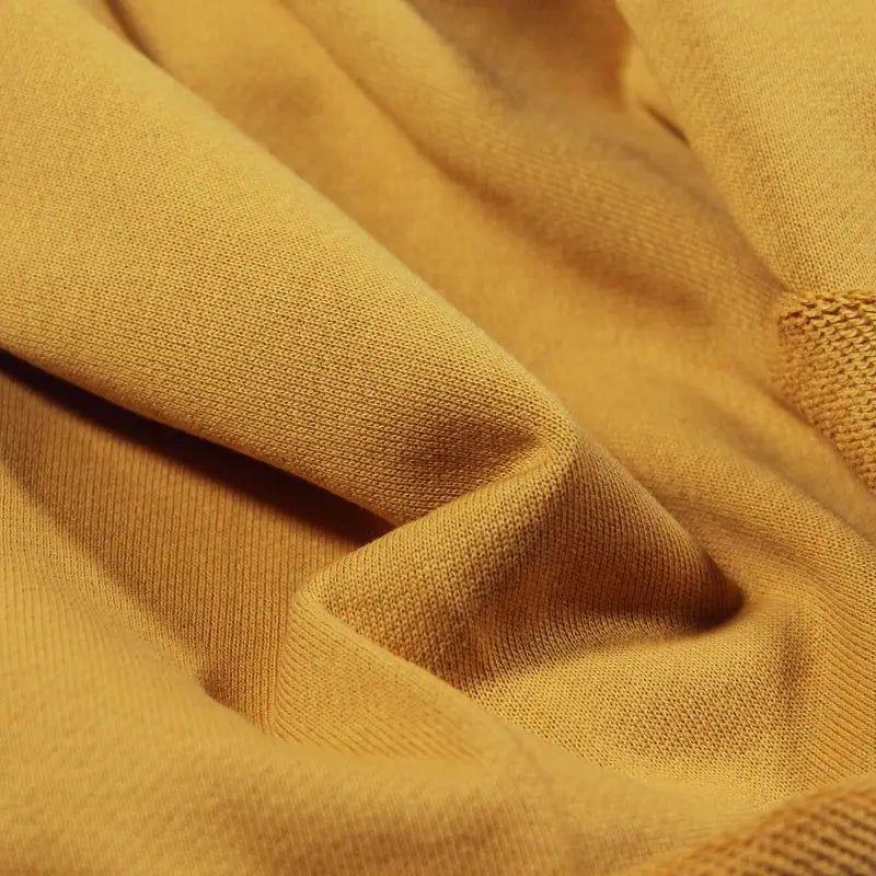 Close-up of Longan Craft Solid Color Cotton French Terry Fabric by the Yard, showcasing its thick, soft texture and fine knit—ideal material for hoodies and other cozy projects.