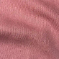 Close-up of Longan Craft's Solid Color Denim Lyocell Fabric By The Yard, showing textured pink, wrinkle-free material with diagonal lines and soft folds that highlight its breathable, comfy quality—ideal for jeans and apparel.